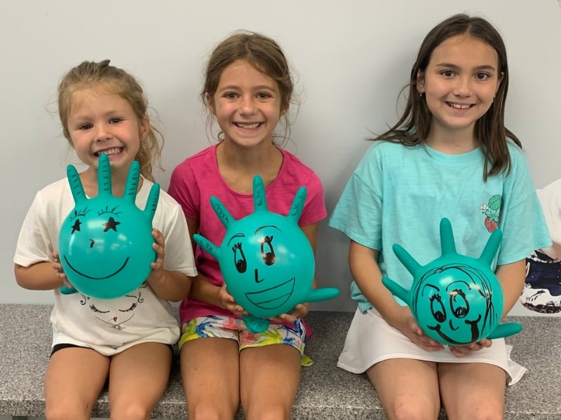 A group of three smiling girls at Springer Orthodontist office