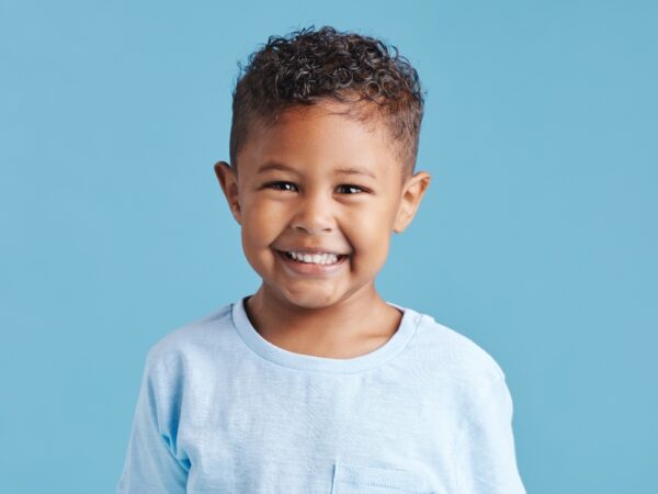 A happy smiling boy looking at the camera