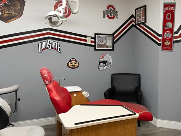 Examination room decorated in an Ohio State University theme at Springer Orthodontics.